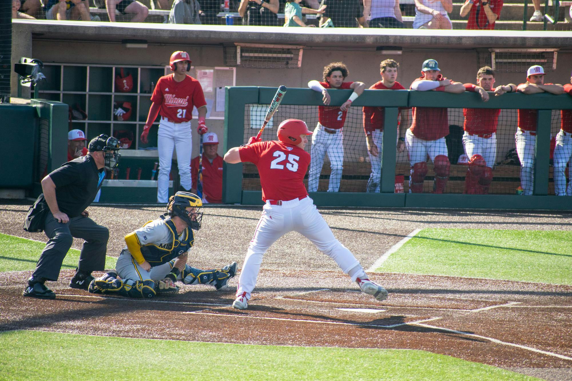 Junior Tommy Harrison steps into his swing during game against Michigan on April 21.