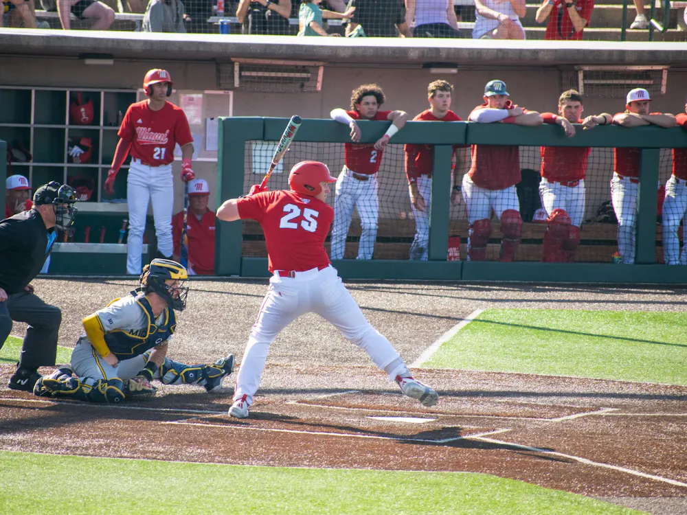 Junior Tommy Harrison steps into his swing during game against Michigan on April 21.