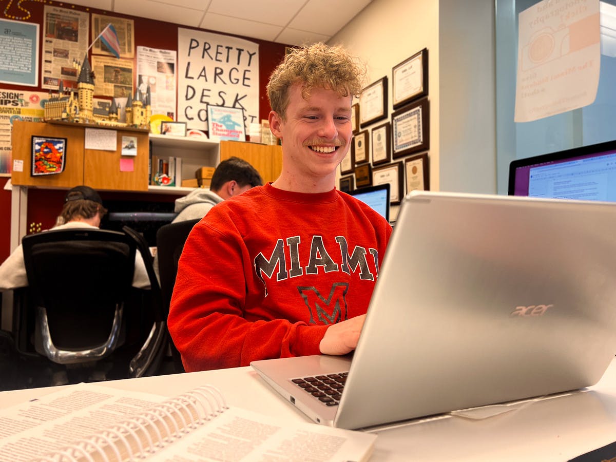 Kasey Turman is all smiles when in the newsroom. Photo by Sarah Frosch﻿