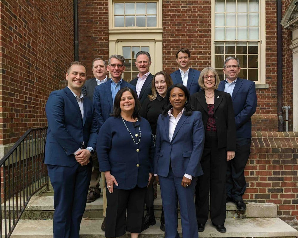 <p>James Vinch, third from the left﻿, stands with other members of the Alumni Pre-law Advisory Board. The group helps undergraduate students prepare for law school. Photo courtesy of Miami University</p>