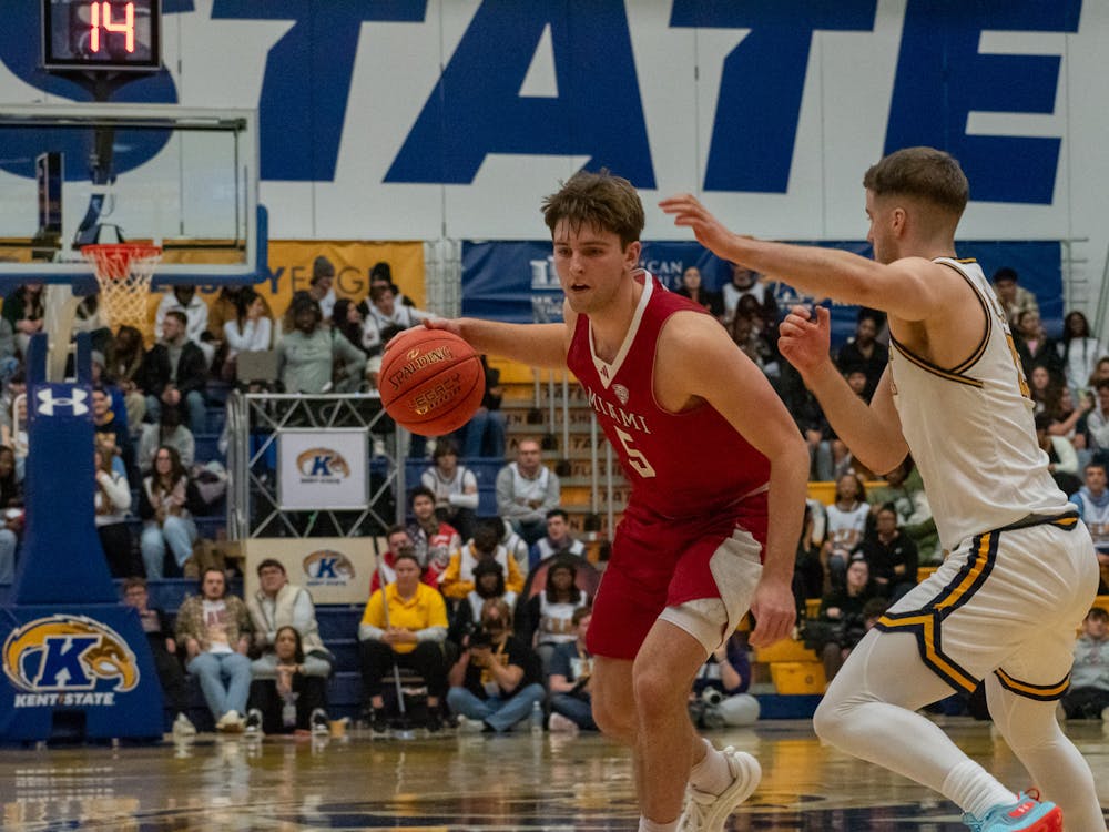 Junior guard Peter Suder dribbling against Kent State on Jan. 18