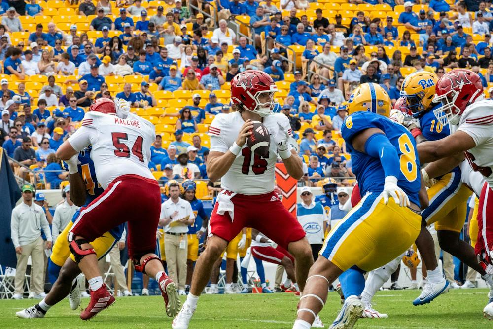 <p>Redshirt freshman Quarterback David McComb drops back to pass in game against the University of Pittsburgh on Sept. 5.</p>