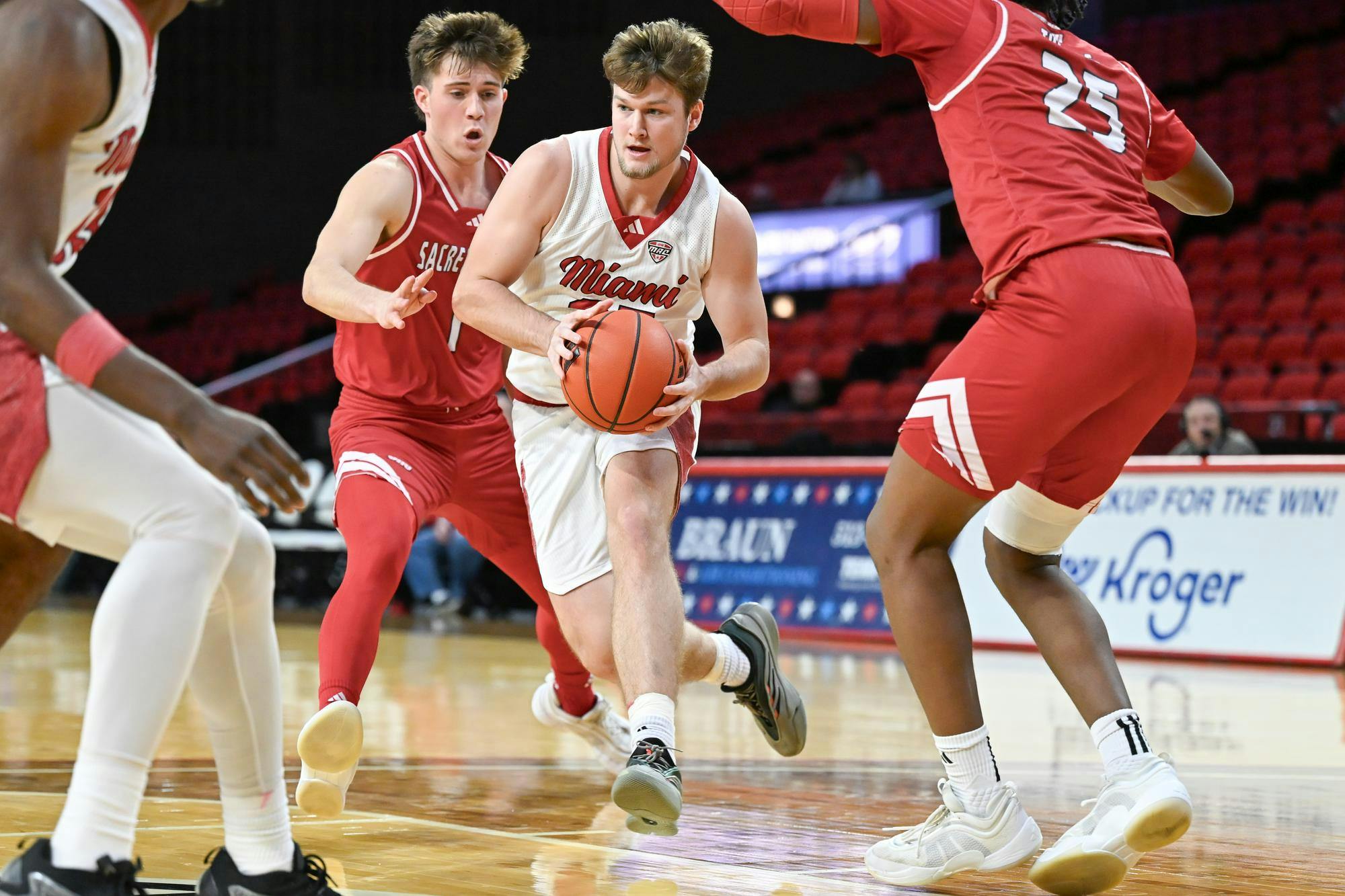 Dan Luers drives for the hoop at Millett Hall against Sacred Heart on Dec. 22, 2024.