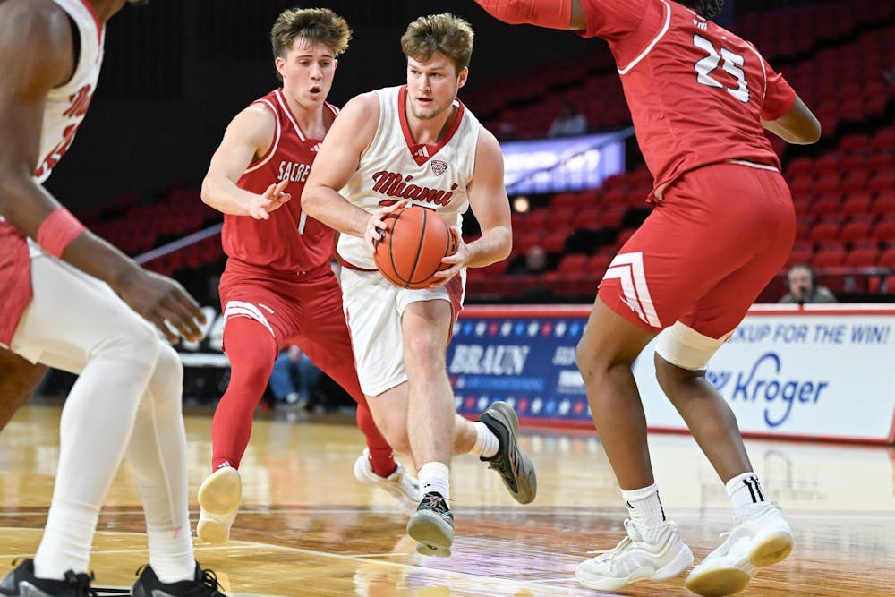 Dan Luers drives for the hoop at Millett Hall against Sacred Heart on Dec. 22, 2024.