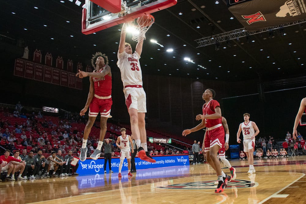 Sophomore center Reece Center going for a dunk against Northern Illinois on Feb. 25