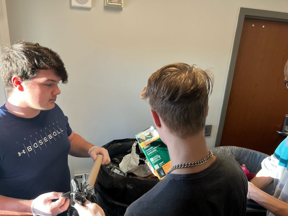 <p>EcoReps members comb through dorm trash bins looking for recyclable items to determine the habits﻿ of students, whether good or bad. Photo provided by Austin Smith. ﻿</p>
