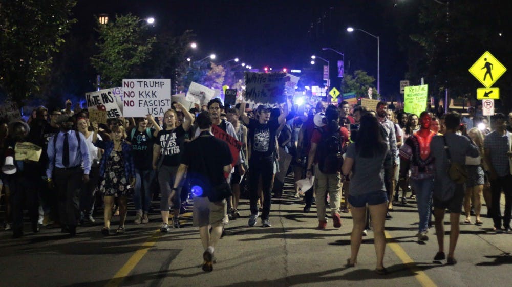 The rally swelled as it progressed past Benton Hall, joined by students off the street.

Photo by Ryan Terhune