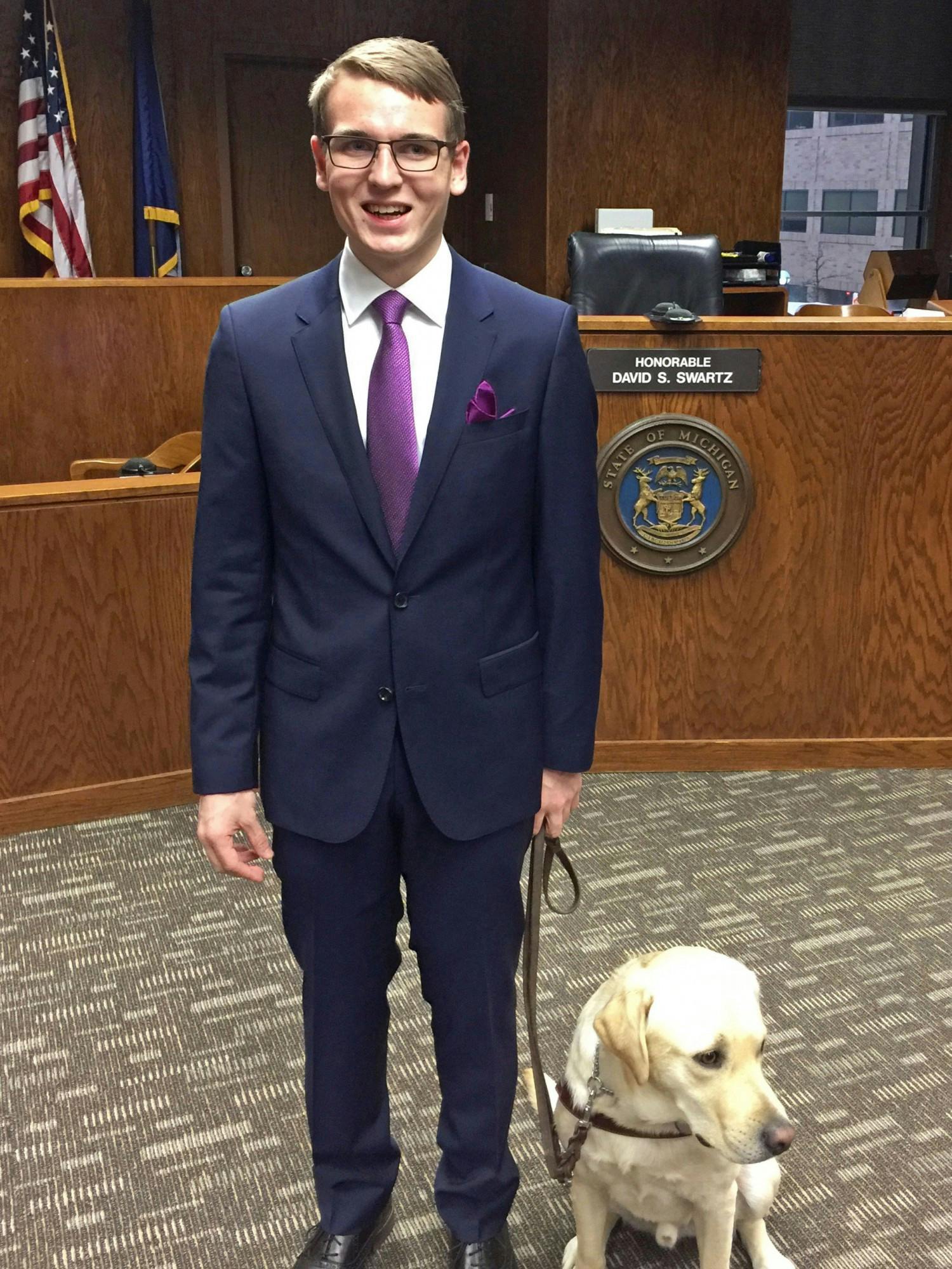Michael Molchan received his guide dog, Hawkins, as a present on his 18th birthday. 