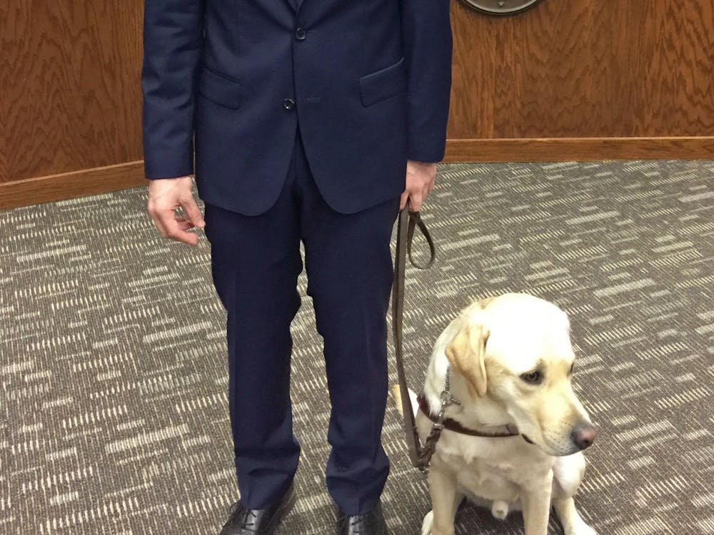 Michael Molchan received his guide dog, Hawkins, as a present on his 18th birthday.