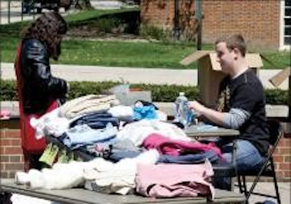 Students collect items Thursday for Miami's first Rag-A-Muffin clothing sale. Half of the profits go back to contributing students.