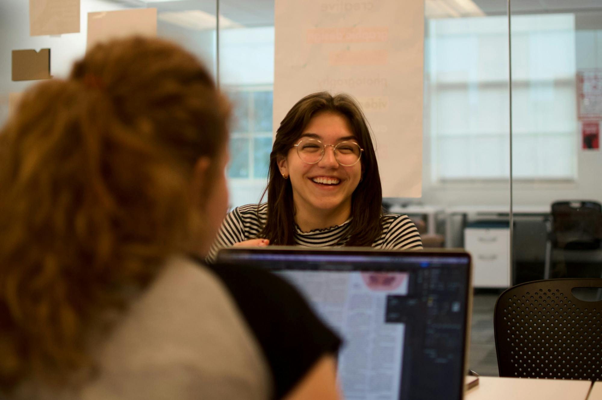Claudia Erne sports a huge smile during one of The Student’s production nights.