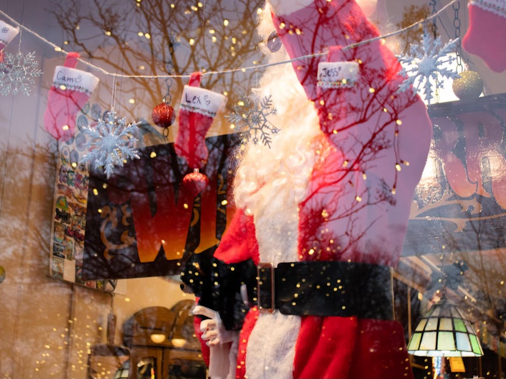Wild Berry's shop window is decked out with stockings and a fake Santa Claus.