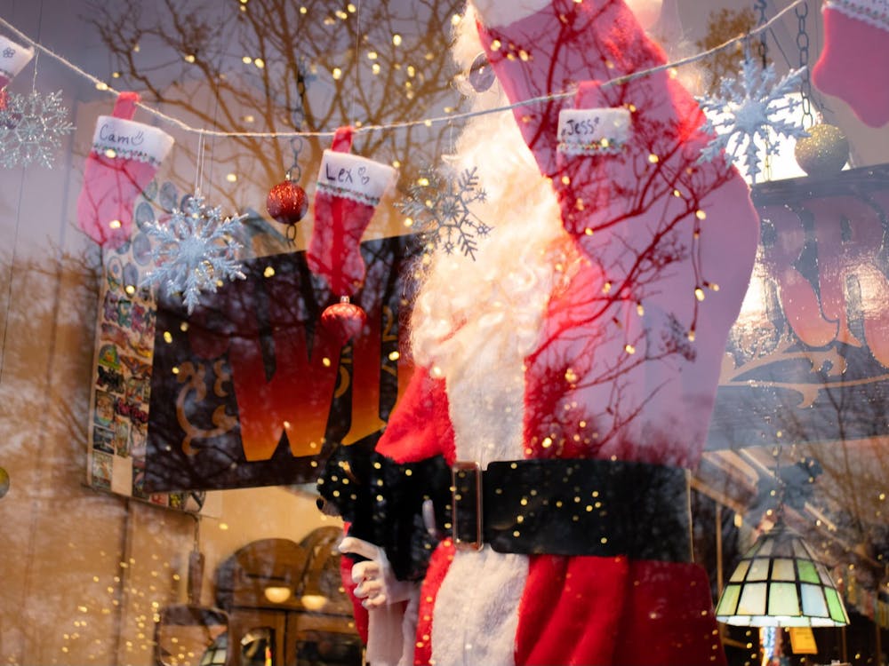 Wild Berry&#x27;s shop window is decked out with stockings and a fake Santa Claus.