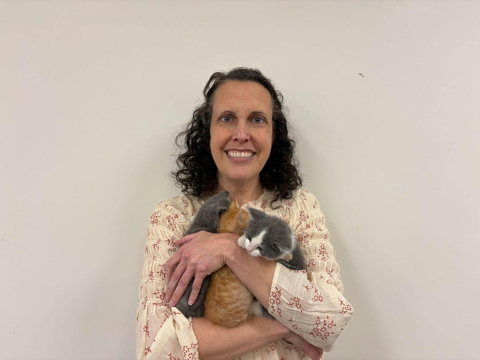 Myers holds the kittens she fosters.