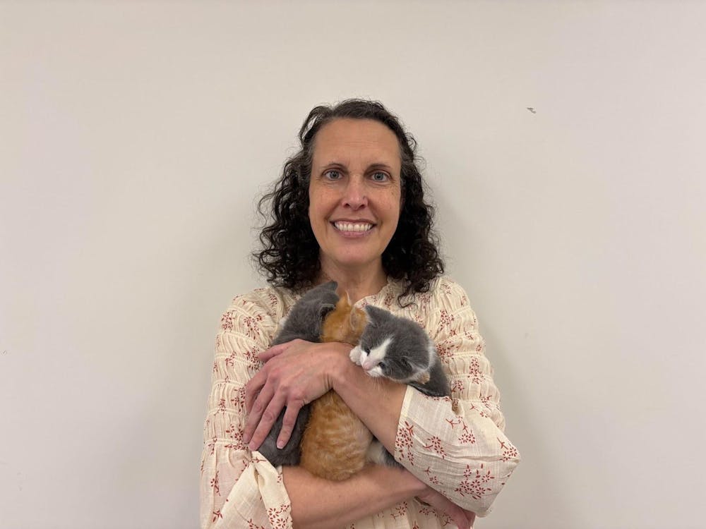 <p>Myers holds the kittens she fosters.</p>