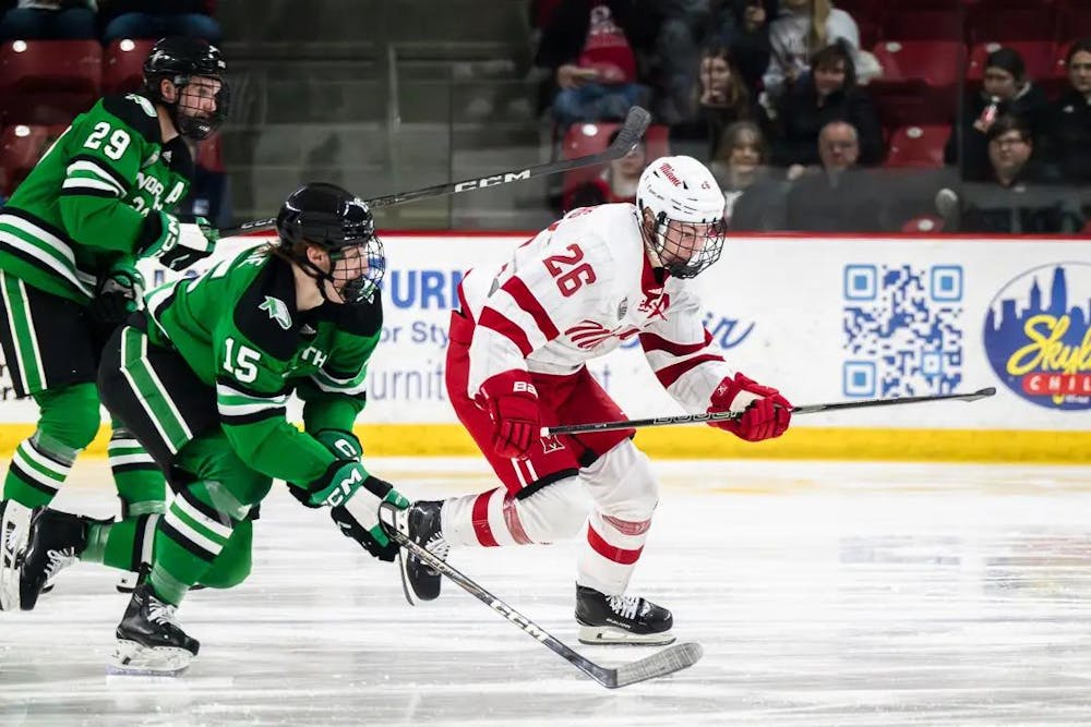 Miami University forward Blake Mesenburg skates against the University of North Dakota Fighting Hawks at Goggin Ice Center in the 2024-25 season.