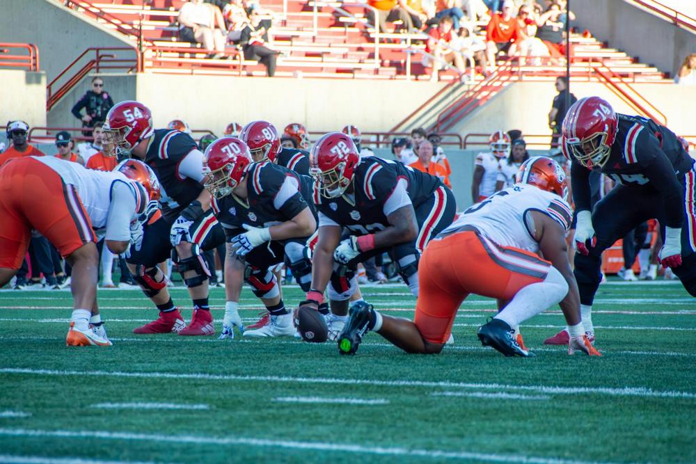 Miami’s offensive line gets ready for a play in game against Bowling Green State University. 