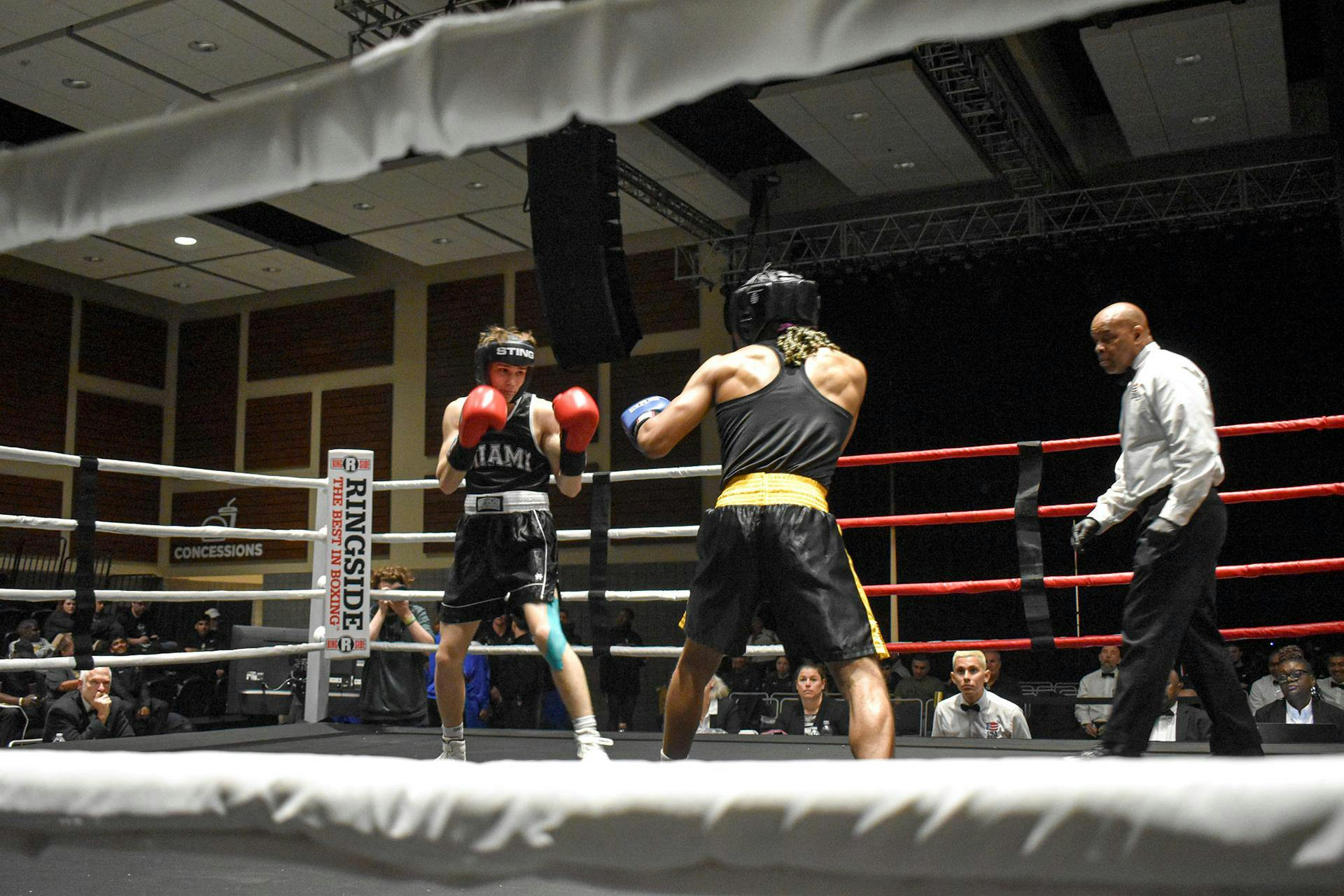 Danny Gomez (left) stands face-to-face with Jordan King (right) in the center of the ring at the NCBA championship on April 12