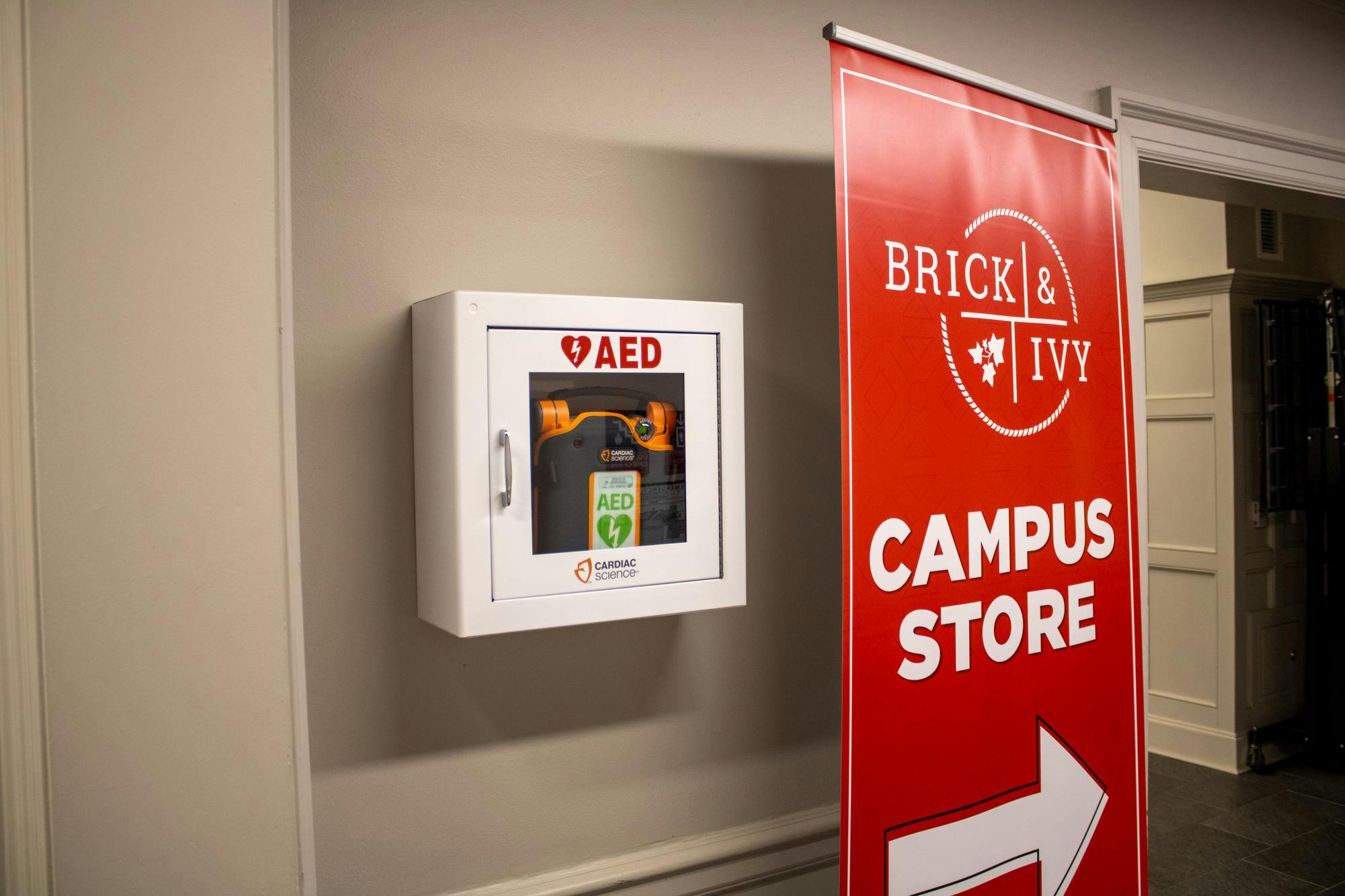 An AED outside the entrance to Brick and Ivy in the Shriver Center.