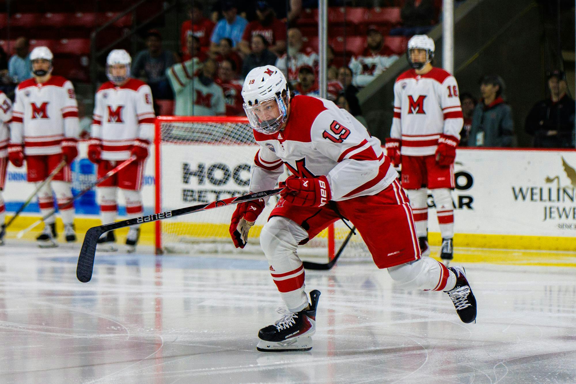 Junior forward Doug Grimes chases after an opponent against Ferris State at Goggin Ice Center on Oct. 3