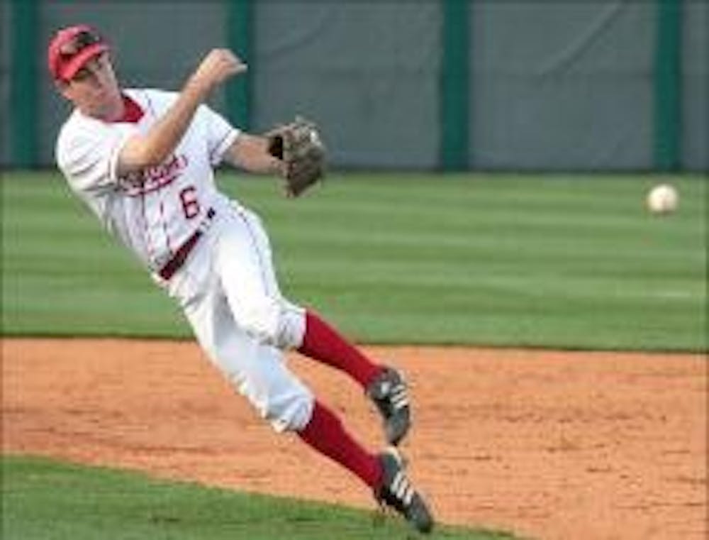 Senior Evan Armitage makes an off balance throw to first base in Miami's 8-5 loss to Indiana State Tuesday in Oxford.