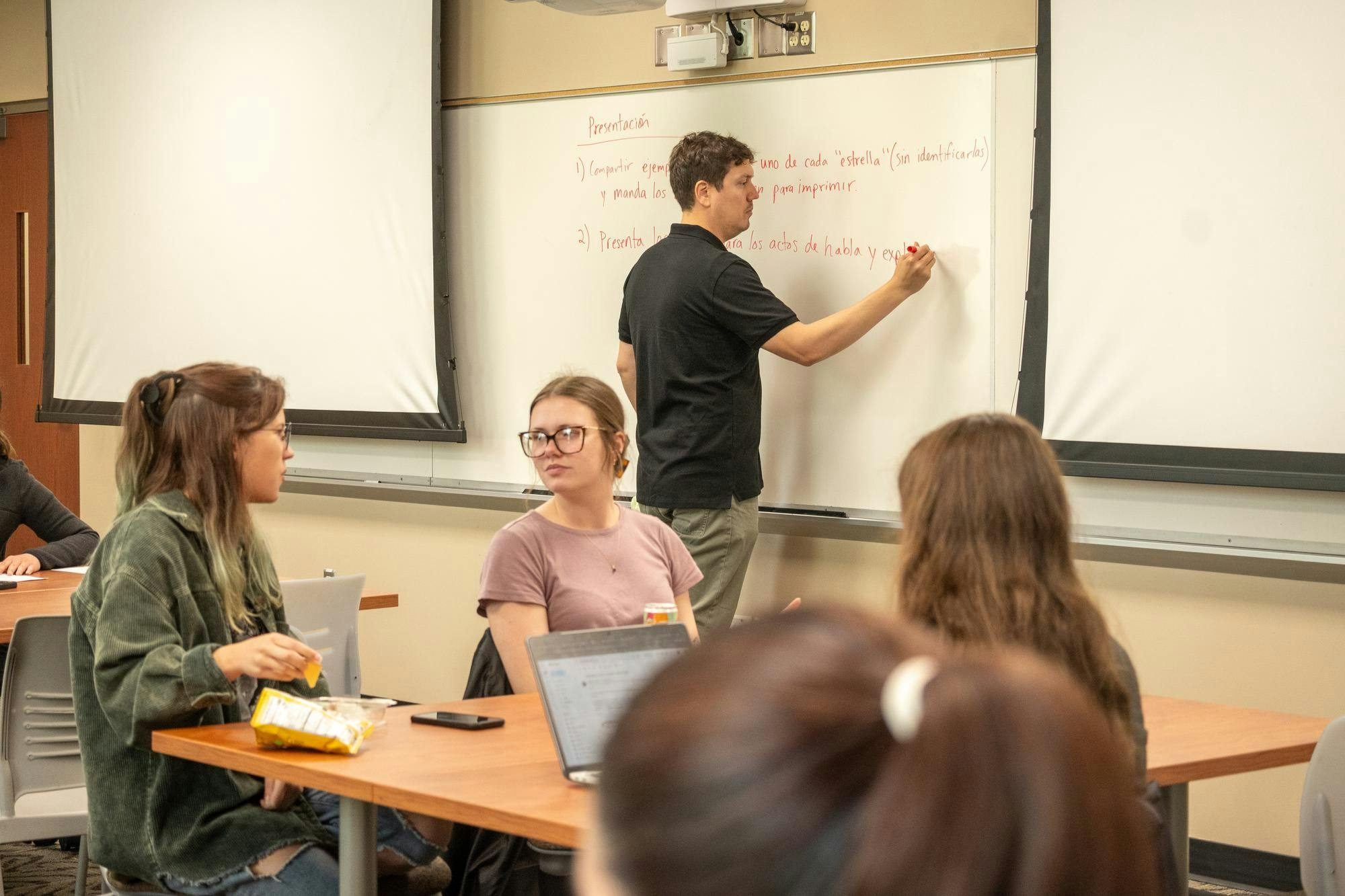 Students collaborate with one another in a Spanish Linguistics class in Kreger 222