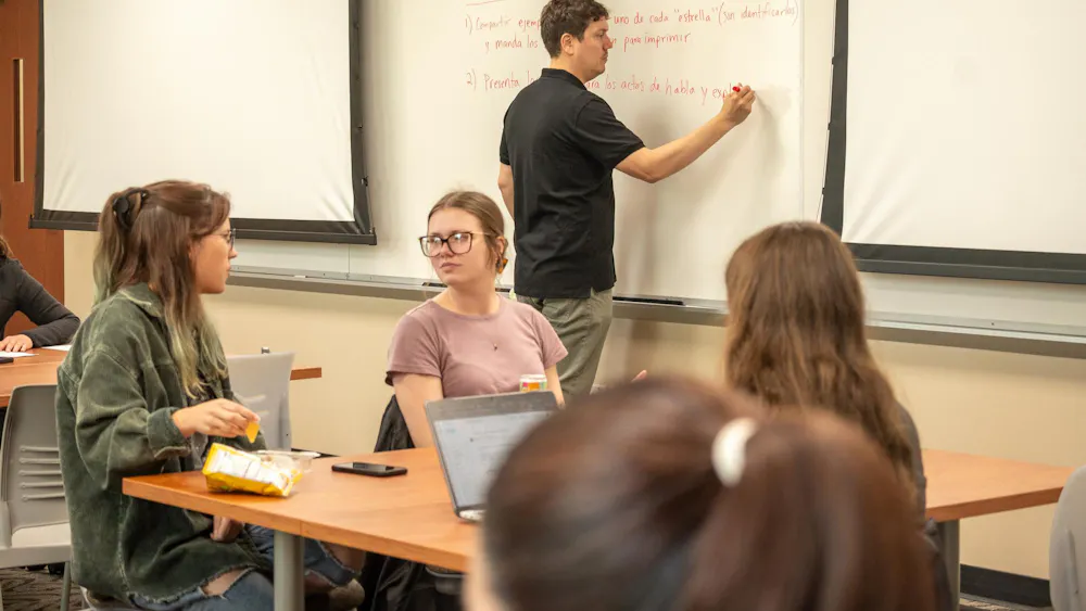 Students collaborate with one another in a Spanish Linguistics class in Kreger 222