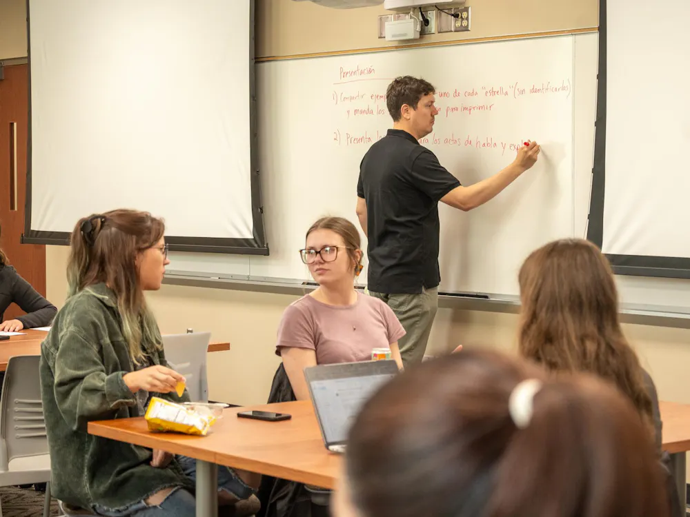 Students collaborate with one another in a Spanish Linguistics class in Kreger 222