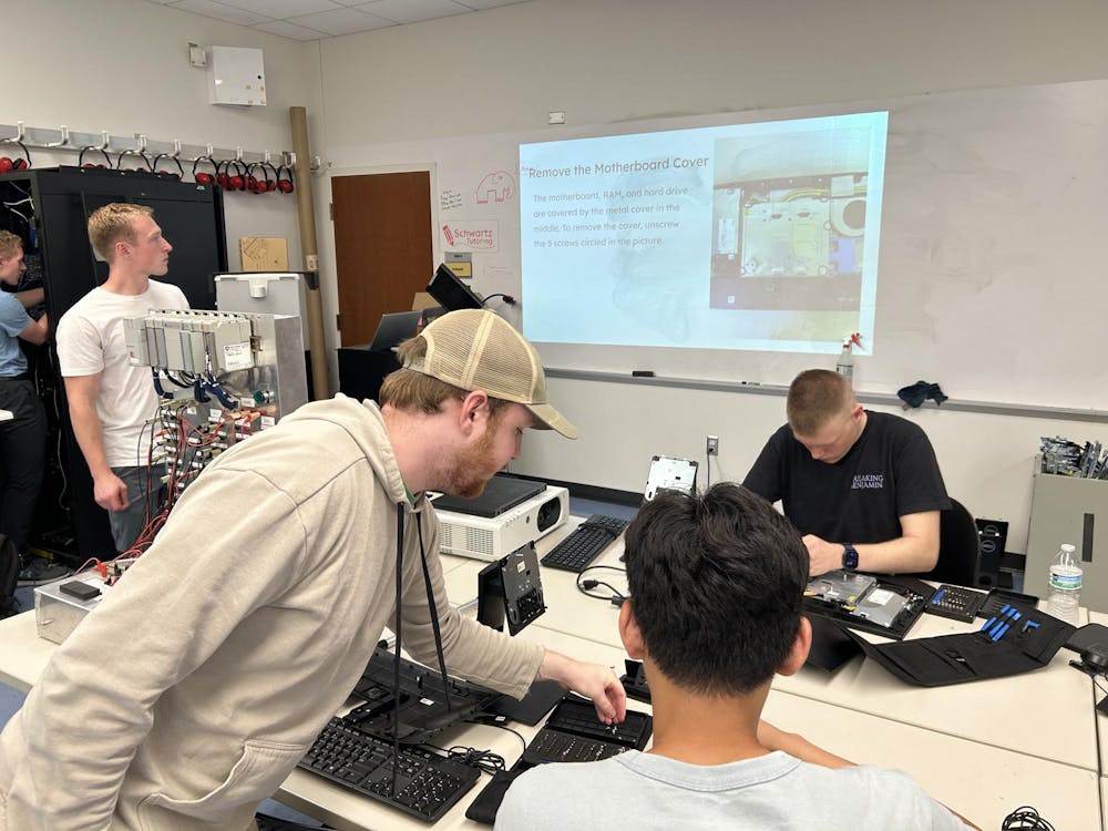 <p>HYPE club members learn how to refurbish computers at a club meeting to prevent E-waste.</p>