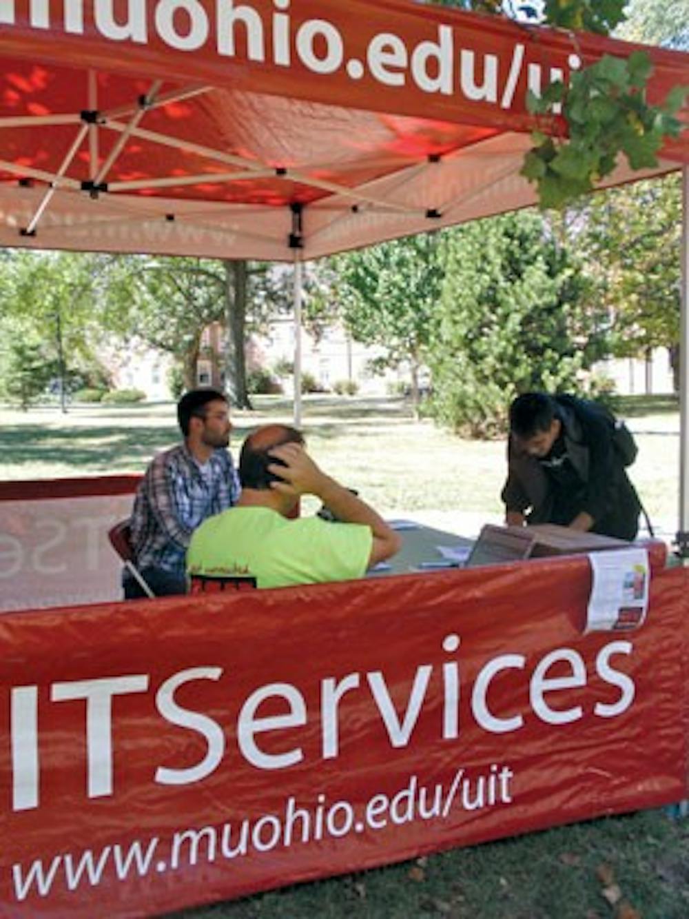 First-year Max Tongtae visits the IT Services Tent Wednesday afternoon.