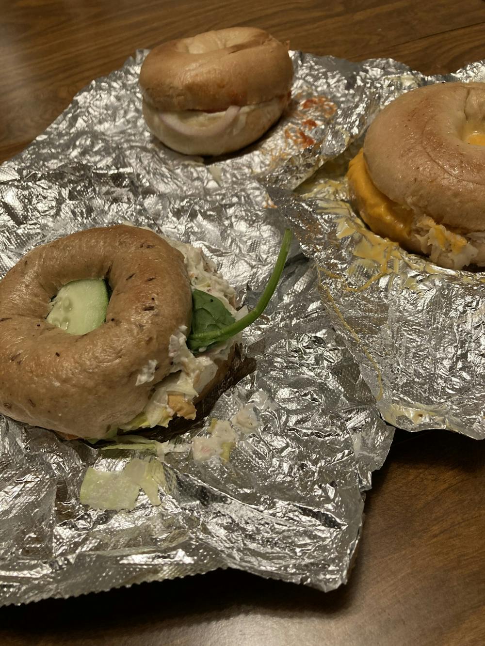 Food Editor Ames Radwan enjoys eating Bagel & Deli. Pictured are B&D’s “Salty Hor” (bottom right), “Kim’s Veggie Pizza” (top center) and “Earth Day” (bottom left) bagels.