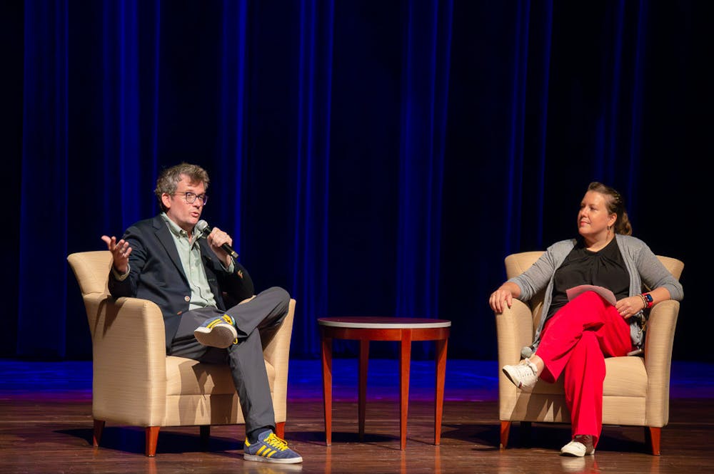 John Green and Dr. Rosemary Pennington discuss Green's work during a lecture in Hall Auditorium.