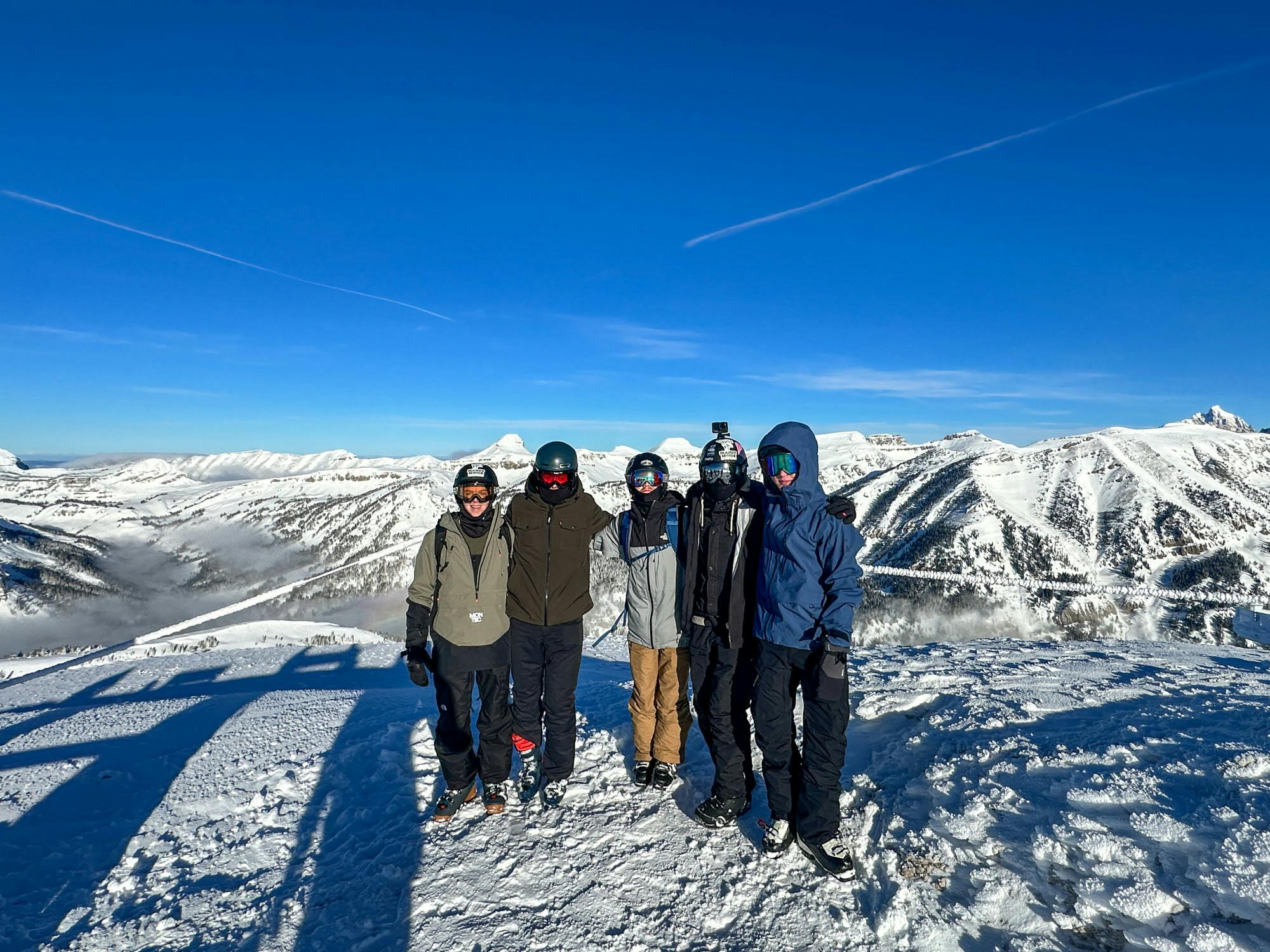 Author Sam Norton (middle) poses at the top of Jackson Hole Resort with his trip roommates.﻿
