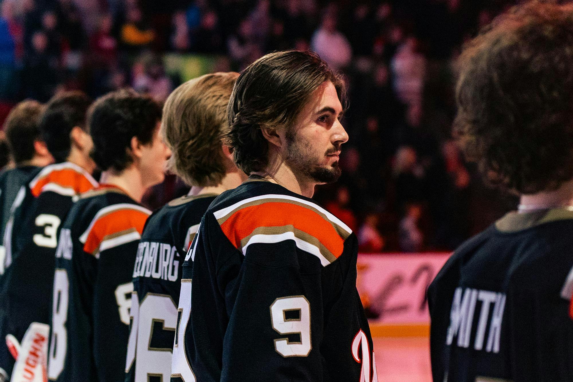 Kyle Aucoin stands with team before game against the Western Michigan University Broncos on Feb. 6