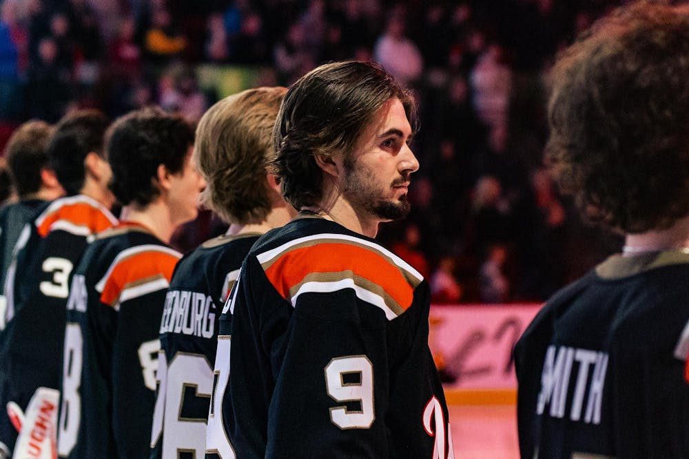Kyle Aucoin stands with team before game against the Western Michigan University Broncos on Feb. 6