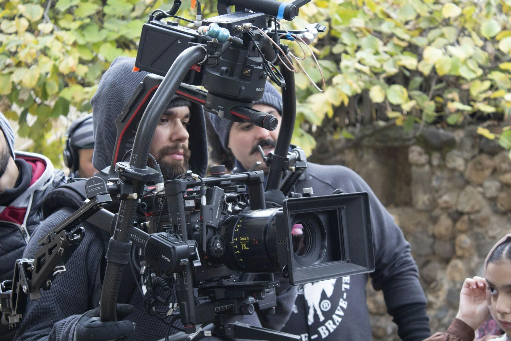 Professor A.J. Rickert-Epstein (pictured in center of camera apparatus) plays double duty as a visiting professor at Miami and as a cinematographer. 