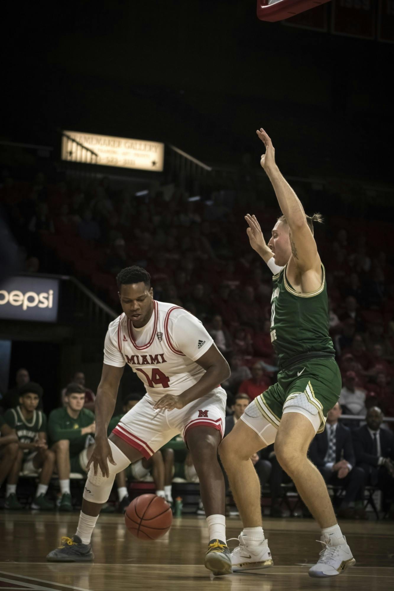 Senior forward Bam Bowman posts up against a Wright State defender Nov. 9 at Millett Hall. Bowman scored four points during an 88-81 Miami loss.