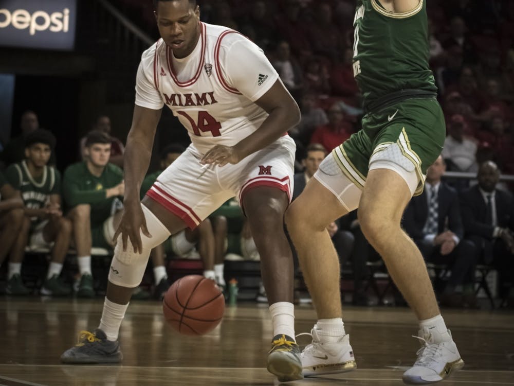 Senior forward Bam Bowman posts up against a Wright State defender Nov. 9 at Millett Hall. Bowman scored four points during an 88-81 Miami loss.