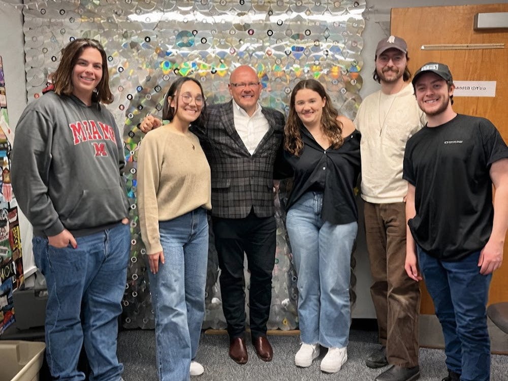 Exec members of RedHawk Radio pose for a photo with President Crawford after his segment on the annual Talk-a-Thon.