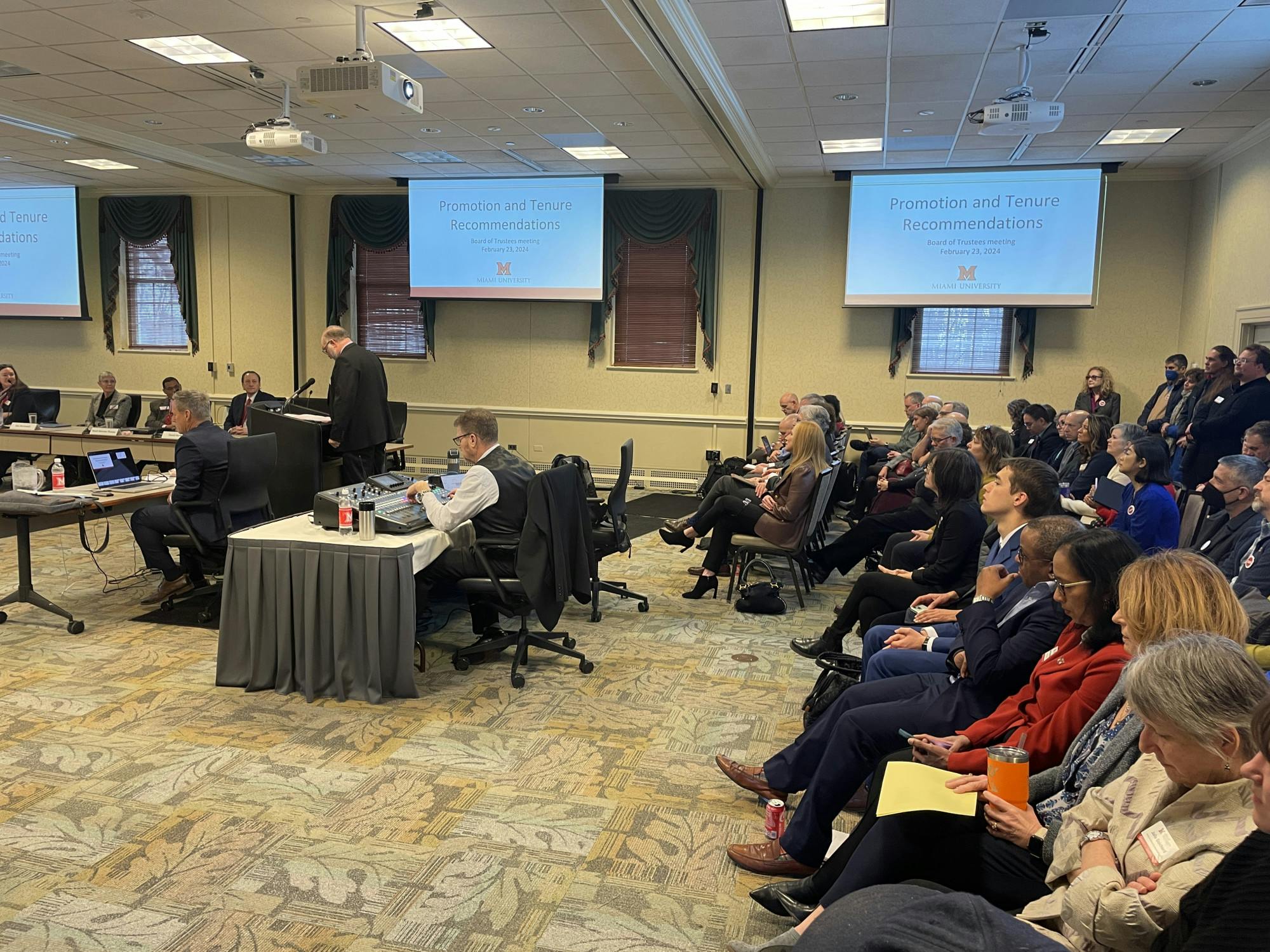 A crowd made its way into the Marcum Hotel to listen to the board of trustees' reports on strategic planning and tenure and promotion.