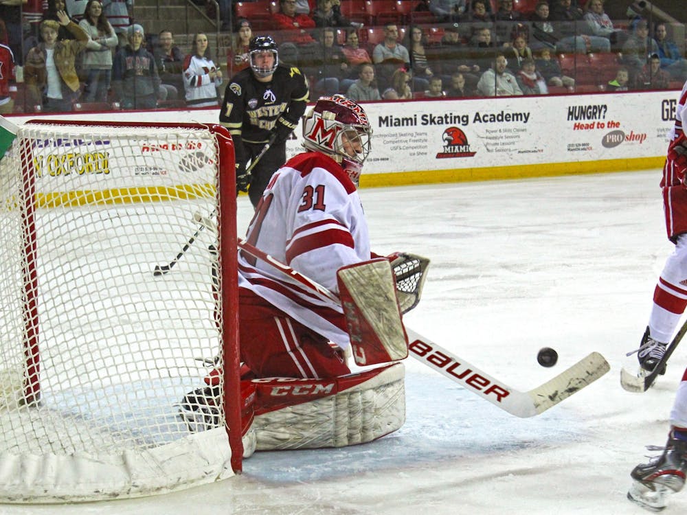 Senior goaltender Ryan Larkin hurries to block a shot in a 2-2 tie against Western Michigan on Feb. 14 at the Goggin Ice Center. Larkin stopped 26 shots.
