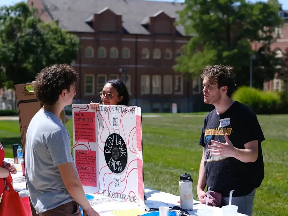 Connor Donaldson and Karsen Davidson recruit new members for RedHawk Radio at fall Megafair.