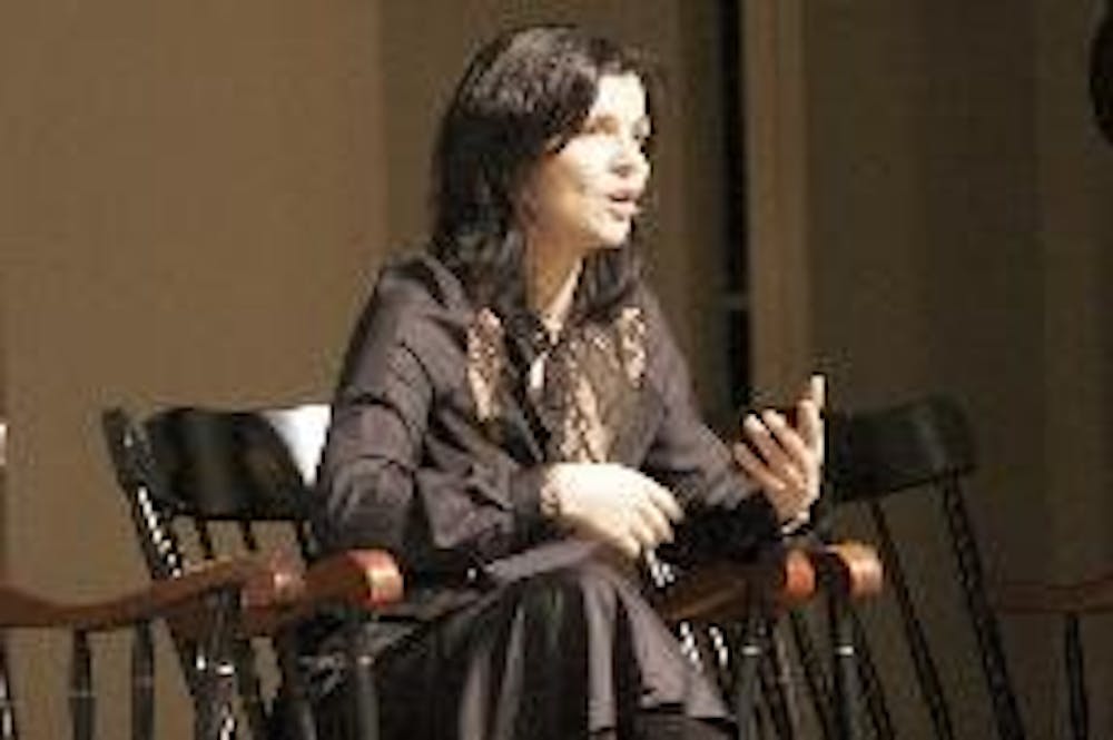 Ali Hewson, co-founder of Edun Apparel Ltd. and the wife of U2 musician Bono, speaks with other company executives Wednesday at Hall Auditorium.