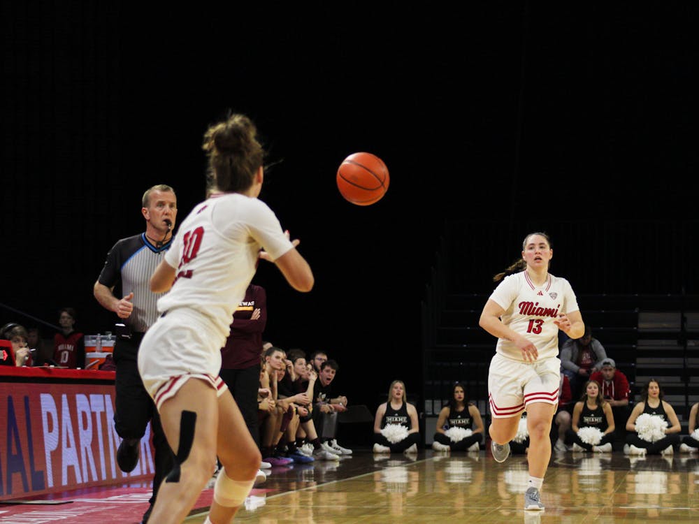 Graduate student guard Maya Chandler passes the ball to first-year guard Tamar Singer during game against Central Michigan at Millett Hall on March 5