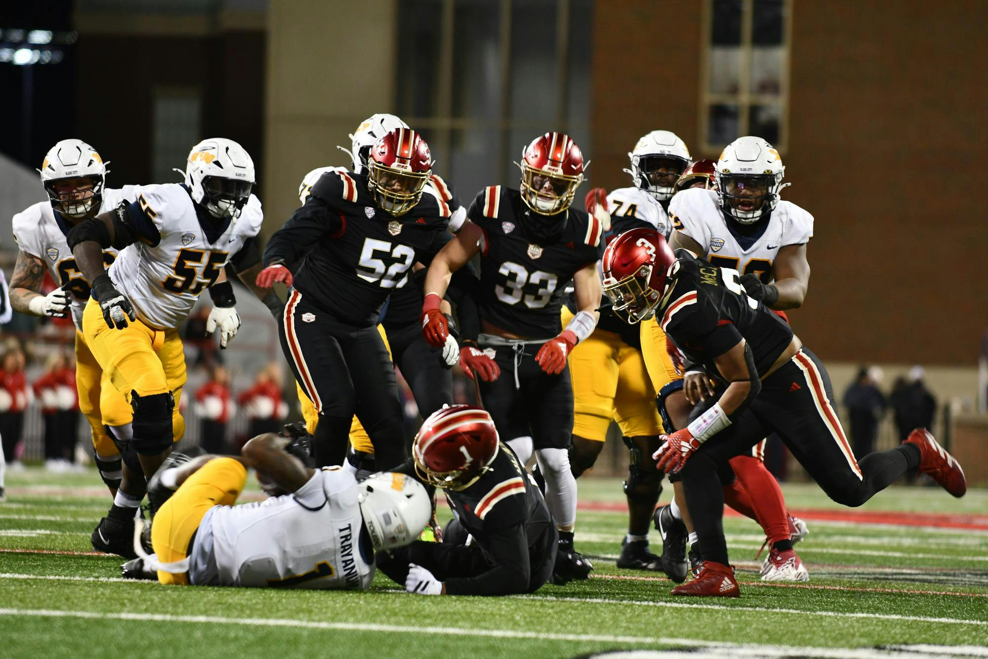 The Miami defense tackles a Toledo player at Yager Stadium on Nov. 12