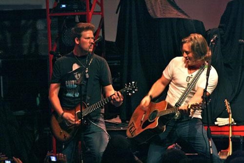Jake Owen shreds with his guitarist last Wednesday. Owen performed to a sold-out crowd.