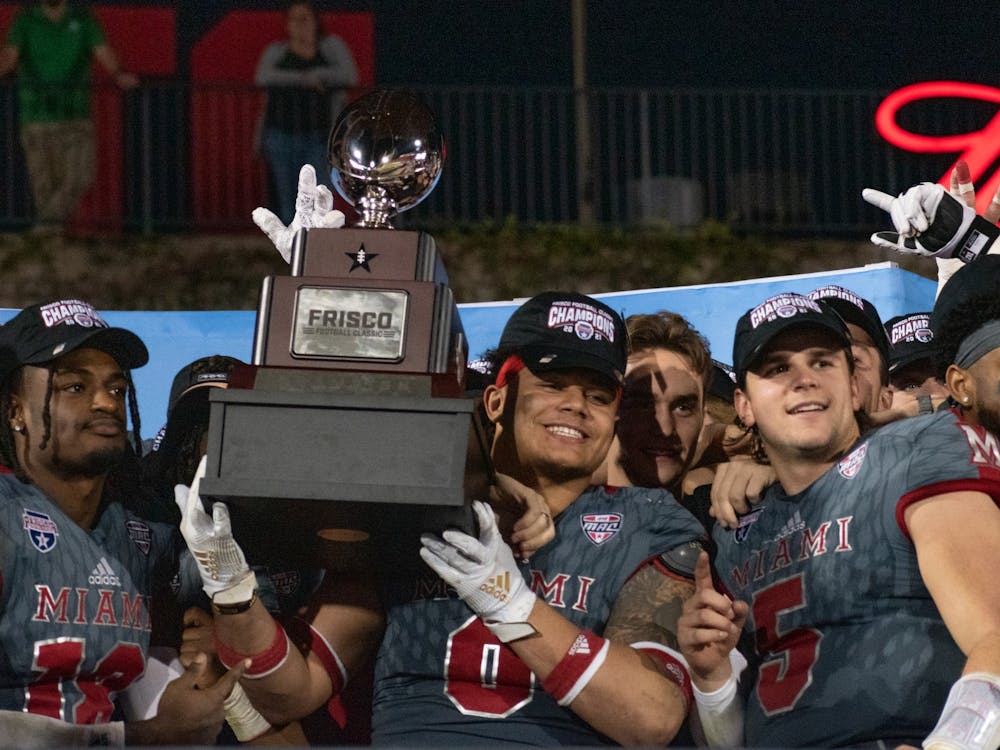 Sophomore Ivan Pace Jr. holds the Frisco Football Classic trophy after Miami&#x27;s 28-17 win over North Texas. Pace Jr. transferred to the University of Cincinnati following the season.