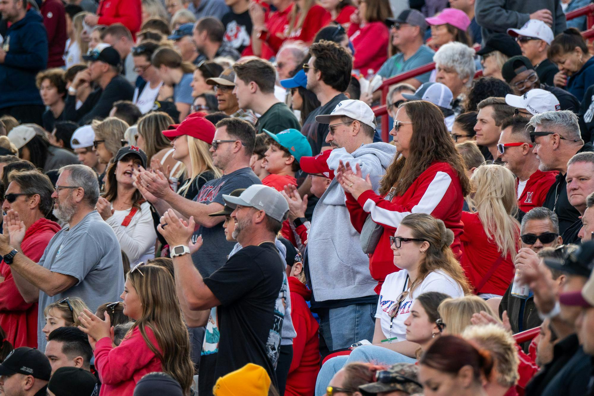 Parents of the Miami University marching band, cheer team, Shakerettes and football team line the stands at the Snoop Dogg Arizona Bowl game in Tucson, Arizona, on Dec. 27.