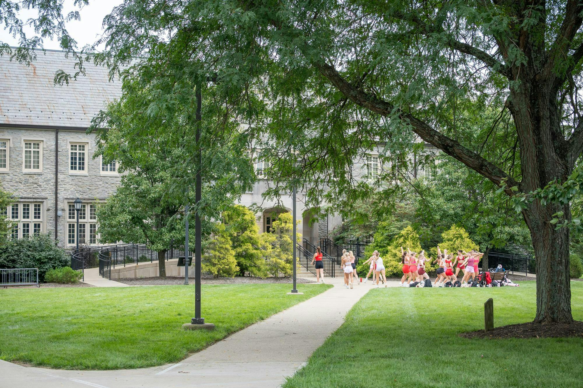The dance team practices outside of Presser Hall.