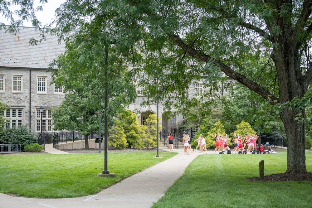The dance team practices outside of Presser Hall.